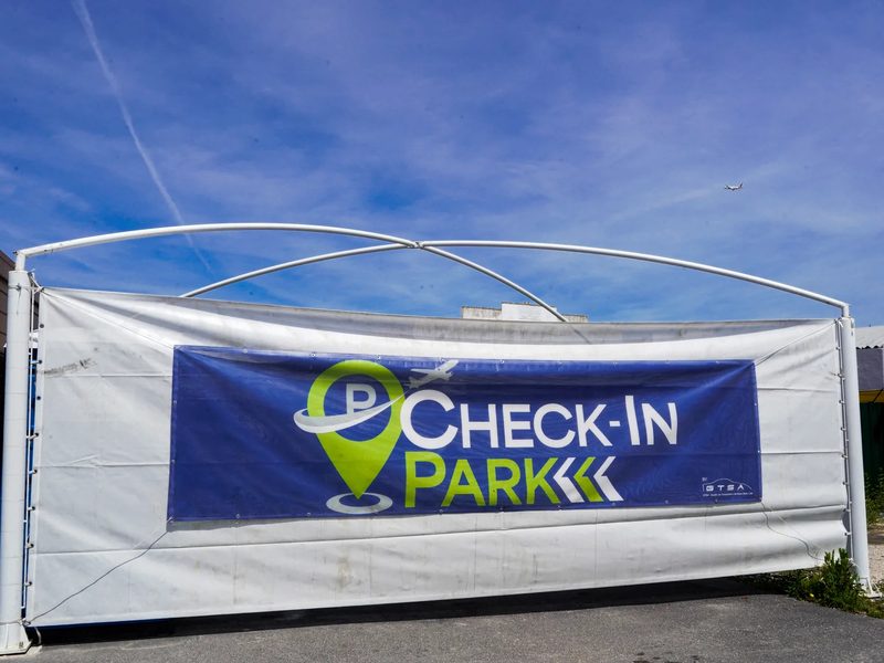 Check-in Park banner at the car park entrance